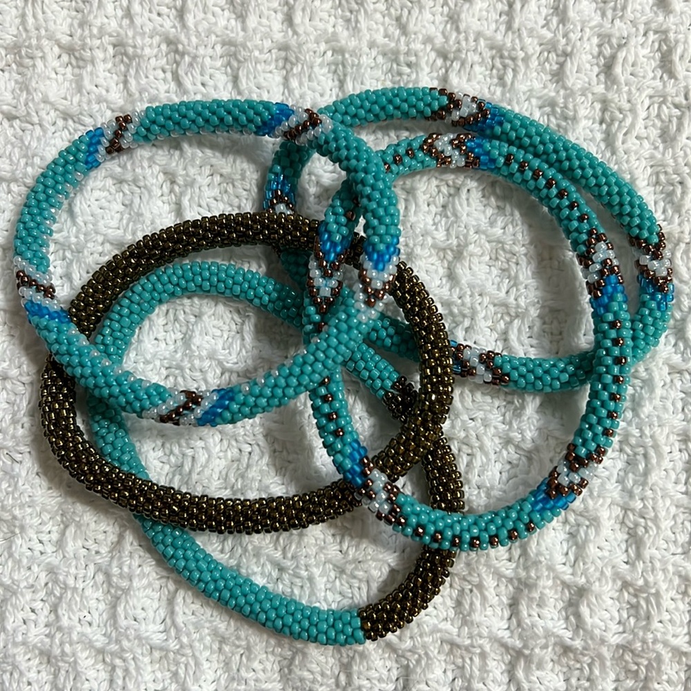 5 Sashka Co handcrafted beaded bracelets. Turquoise & bronze colored. Approx 8”.